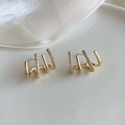 European and American fashion retro zircon four-claw earrings high-grade temperament simple zircon female silver pin earrings flash earrings