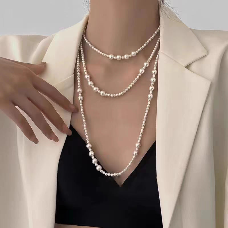 Multi-layer stacked Shijia pearl sweater chain long necklace women's round strong light Joker feeling autumn and winter accessories manufacturers batch