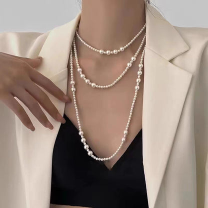 Multi-layer stacked Shijia pearl sweater chain long necklace women's round strong light Joker feeling autumn and winter accessories manufacturers batch