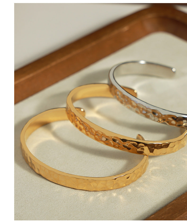 New simple personality niche design titanium steel gold-plated irregular bump hammer face opening bracelet women's jewelry wholesale
