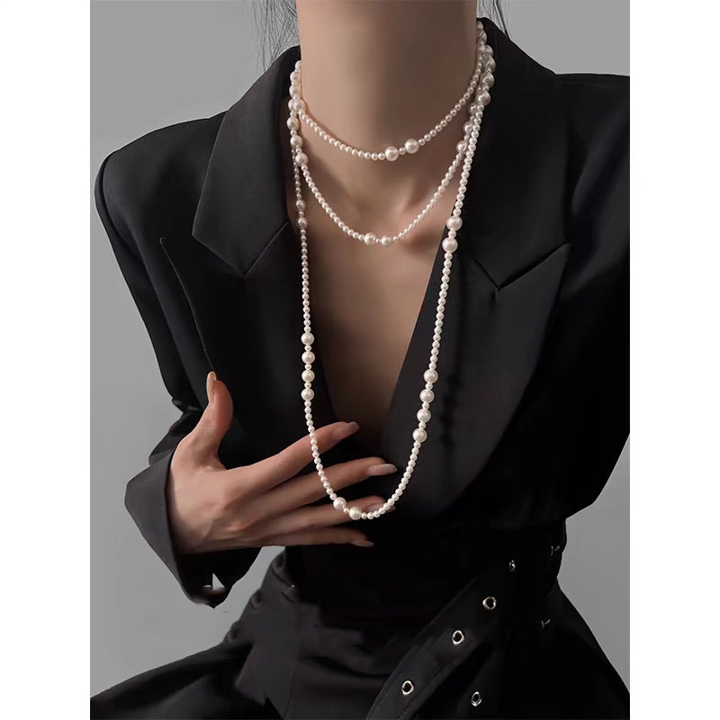 Multi-layer stacked Shijia pearl sweater chain long necklace women's round strong light Joker feeling autumn and winter accessories manufacturers batch