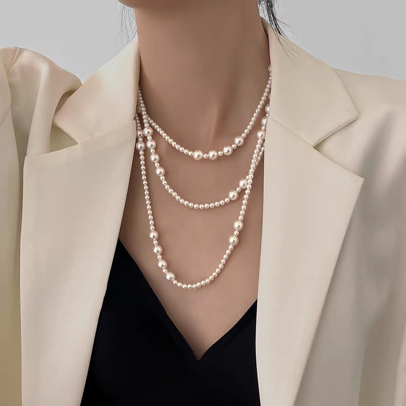 Multi-layer stacked Shijia pearl sweater chain long necklace women's round strong light Joker feeling autumn and winter accessories manufacturers batch