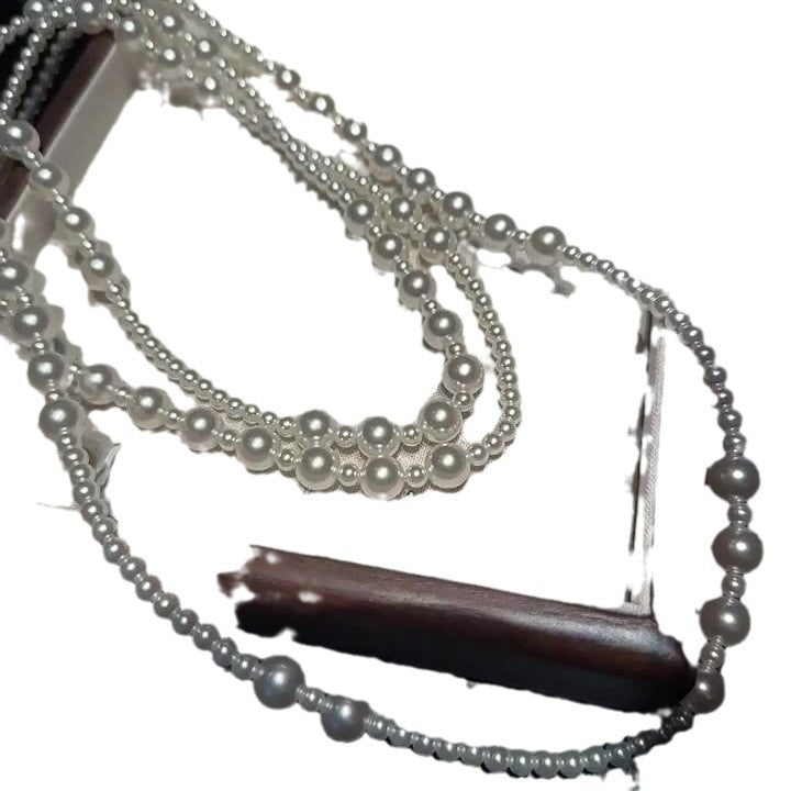 Multi-layer stacked Shijia pearl sweater chain long necklace women's round strong light Joker feeling autumn and winter accessories manufacturers batch